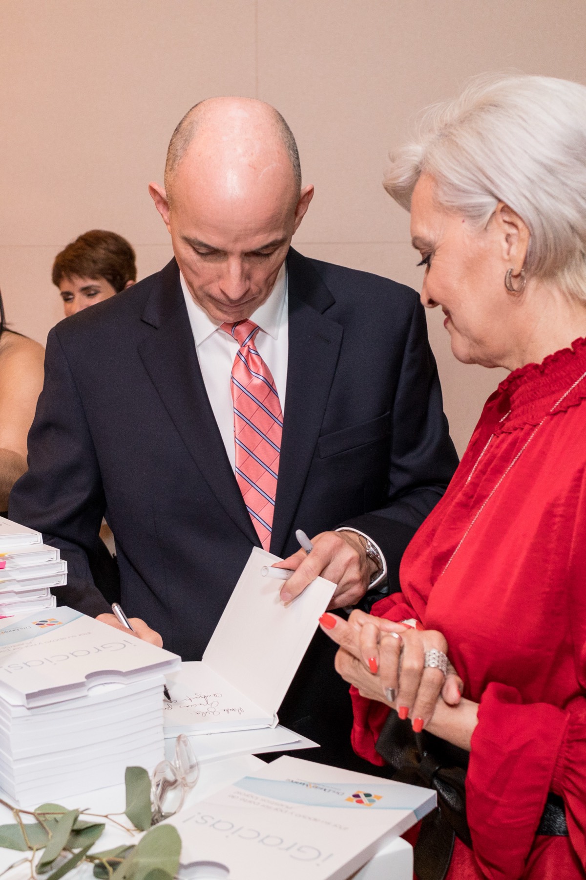 Signing copies at the book launch